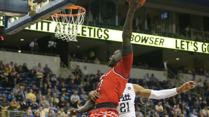 Jan 24, 2017; Pittsburgh, PA, USA; Louisville Cardinals forward Deng Adel (22) is fouled as he shoots against Pittsburgh Panthers forward Sheldon Jeter (21) during the second half at the Petersen Events Center. The Cardinals won 106-51. Mandatory Credit: Charles LeClaire-USA TODAY Sports