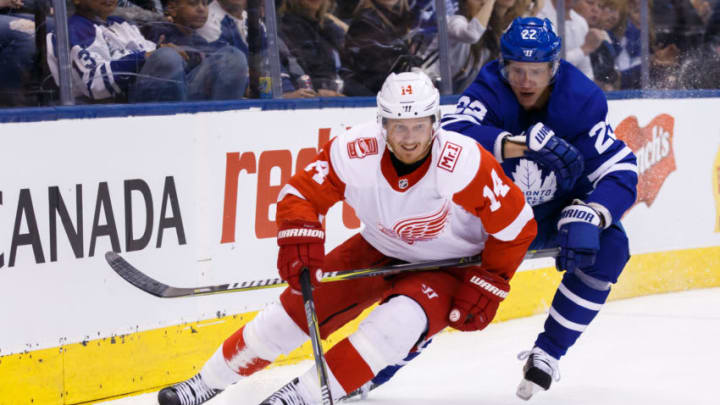 TORONTO, ON - MARCH 24: Gustav Nyquist #14 of the Detroit Red Wings skates the puck against Nikita Zaitsev #22 of the Toronto Maple Leafs during the first period at the Air Canada Centre on March 24, 2018 in Toronto, Ontario, Canada. (Photo by Kevin Sousa/NHLI via Getty Images)