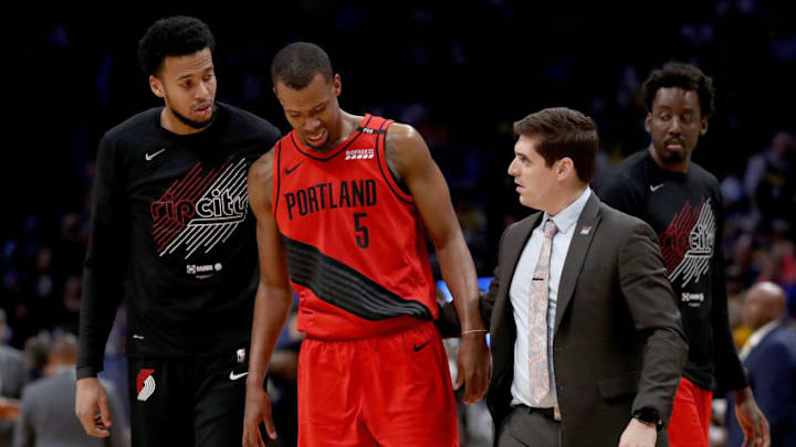 DENVER, COLORADO - MAY 12: Rodney Hood #5 of the Portland Trail Blazers is helped off the floor after being injured against the Denver Nuggets in the third quarter during Game Seven of the Western Conference Semi-Finals of the 2019 NBA Playoffs at the Pepsi Center on May 12, 2019 in Denver, Colorado. NOTE TO USER: User expressly acknowledges and agrees that, by downloading and or using this photograph, User is consenting to the terms and conditions of the Getty Images License Agreement. (Photo by Matthew Stockman/Getty Images)