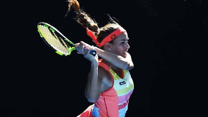 MELBOURNE, AUSTRALIA - JANUARY 15: Monica Puig of Puerto Rico plays a backhand in her first round match against Samantha Stosur of Australia on day one of the 2018 Australian Open at Melbourne Park on January 15, 2018 in Melbourne, Australia. (Photo by Quinn Rooney/Getty Images)