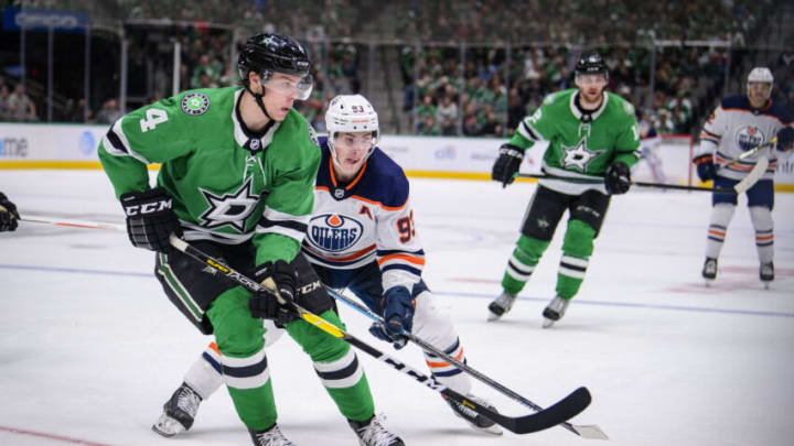 Mar 3, 2020; Dallas, Texas, USA; Dallas Stars defenseman Miro Heiskanen (4) and Edmonton Oilers center Ryan Nugent-Hopkins (93) in action during the game between the Stars and the Oilers at the American Airlines Center. Mandatory Credit: Jerome Miron-USA TODAY Sports