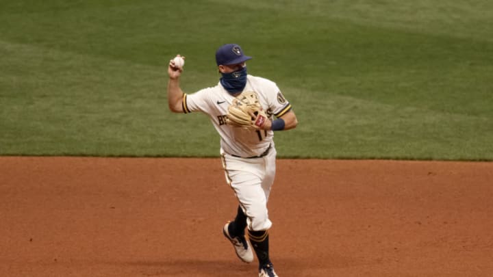 MILWAUKEE, WISCONSIN - AUGUST 03: Brock Holt #11 of the Milwaukee Brewers throws second base in the ninth inning against the Chicago White Sox at Miller Park on August 03, 2020 in Milwaukee, Wisconsin. (Photo by Dylan Buell/Getty Images)