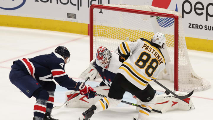 Apr 8, 2021; Washington, District of Columbia, USA; Washington Capitals goaltender Ilya Samsonov (30) makes a save on Boston Bruins right wing David Pastrnak (88) in the third period at Capital One Arena. Mandatory Credit: Geoff Burke-USA TODAY Sports