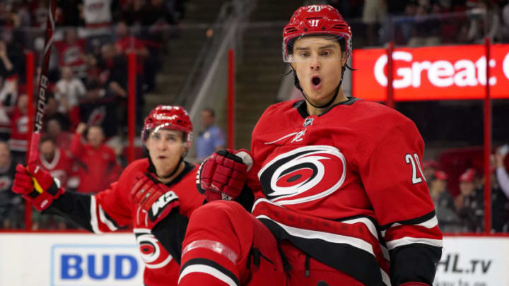 RALEIGH, NC - OCTOBER 09: Carolina Hurricanes Center Sebastian Aho (20) celebrates a goal during a game between the Vancouver Canucks and the Carolina Hurricanes at the PNC Arena in Raleigh, NC on October 9, 2018. Carolina defeated Vancouver 5 - 3. (Photo by Greg Thompson/Icon Sportswire via Getty Images)