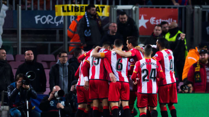 BARCELONA, SPAIN - FEBRUARY 24: Girona FC players celebrate after their teammate Cristian 'Portu' scored the opening goal during the La Liga match between Barcelona and Girona at Camp Nou on February 24, 2018 in Barcelona, Spain. (Photo by Alex Caparros/Getty Images)