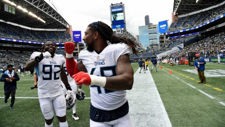 Tennessee Titans outside linebacker Bud Dupree (48) and Tennessee Titans linebacker Ola Adeniyi (92) celebrate their overtime win against the Seahawks at Lumen Field Sunday, Sept. 19, 2021 in Seattle, Wash.Titans Seahawks 174