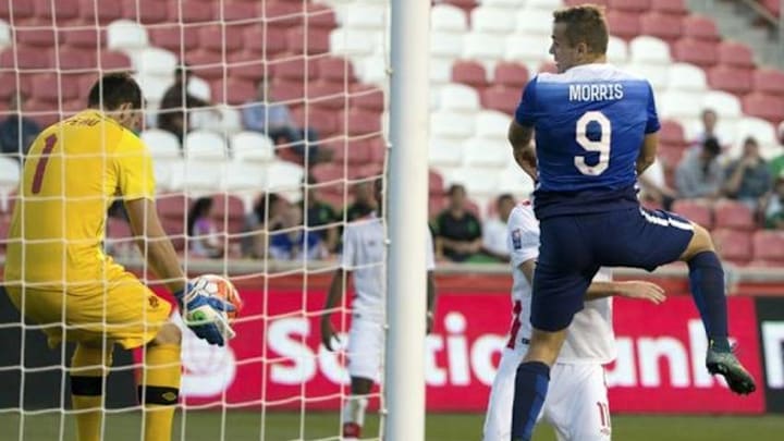 Oct 13, 2015; Sandy, UT, USA; Canada goalkeeper Max Crepeau (1) kicks the ball away from the goal after a head ball by United States forward Jordan Morris (9) during the second half at Rio Tinto Stadium. United States won the game 2-0. Mandatory Credit: Chris Nicoll-USA TODAY Sports