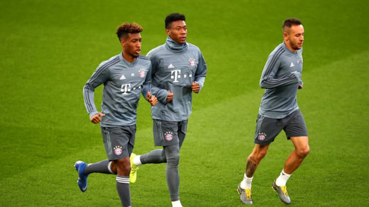 LIVERPOOL, ENGLAND - FEBRUARY 18: Kingsley Coman of Bayern Munich and David Alaba of Bayern Munich warm up during the FC Bayern Muenchen Training Session ahead of the UEFA Champions League Round of 16 First Leg match between Liverpool and FC Bayern Muenchen at Anfield on February 18, 2019 in Liverpool, England. (Photo by Clive Brunskill/Getty Images)