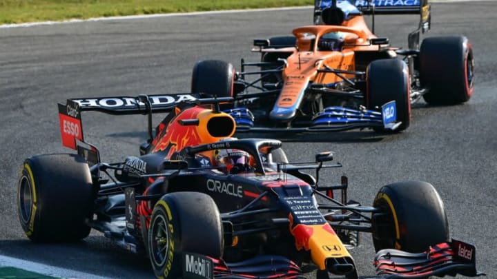 Max Verstappen, Red Bull, and Daniel Ricciardo, McLaren, Formula 1 (Photo by MIGUEL MEDINA/AFP via Getty Images)