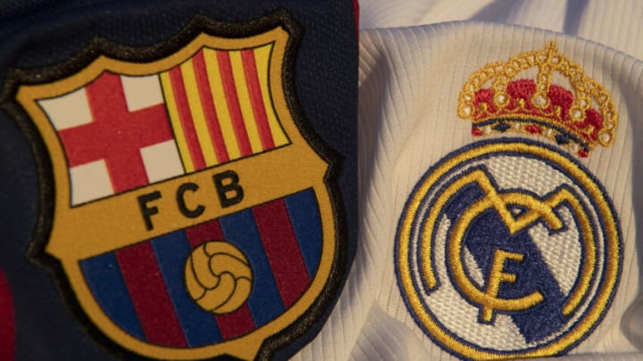 WHICHFORD, ENGLAND - MAY 06: Barcelona and Real Madrid club badges on their respective home shirts for the 2019-20 season on May 6, 2020 in Warwickshire, UK. (Photo by Visionhaus)