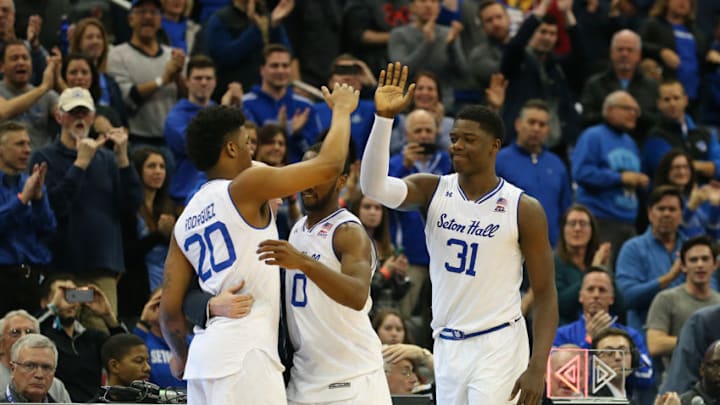 NEWARK, NJ - MARCH 03: Head coach Kevin Willard of the Seton Hall Pirates his his senior players Desi Rodriguez #20, Khadeen Carrington #0 and Angel Delgado #31 after playing in their final home game of their career against the Butler Bulldogs at Prudential Center on March 3, 2018 in Newark, New Jersey. Seton Hall defeated Butler 77-70. (Photo by Rich Schultz/Getty Images)