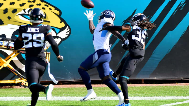 JACKSONVILLE, FLORIDA – DECEMBER 13: A.J. Brown #11 of the Tennessee Titans catches a touchdown pass in front of Sidney Jones #35 of the Jacksonville Jaguars during the first quarter at TIAA Bank Field on December 13, 2020 in Jacksonville, Florida. (Photo by Julio Aguilar/Getty Images)