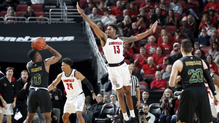 LOUISVILLE, KY – NOVEMBER 16: V.J. King #13 of the Louisville Cardinals defends against Stef Smith #0 of the Vermont Catamounts in the first half of the game at KFC YUM! Center on November 16, 2018 in Louisville, Kentucky. Louisville won 86-78. (Photo by Joe Robbins/Getty Images)
