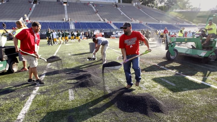 Aug 7, 2016; Canton, OH, USA; Field workers remove rubber pellets from the field before the NFL preseason game between the Green Bay Packers and Indianapolis Colts at Tom Benson Hall of Fame Stadium Mandatory Credit: Rick Wood/Milwaukee Journal Sentinel via USA TODAY Network
