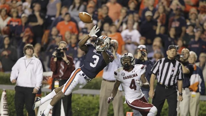 Oct 25, 2014; Auburn, AL, USA; Auburn Tigers defensive back Jonathan Jones (3) intercepts a pass intended for South Carolina Gamecocks receiver Shaq Roland (4) during the second half at Jordan Hare Stadium. The Tigers beat the Gamecocks 42-35. Mandatory Credit: John Reed-USA TODAY Sports