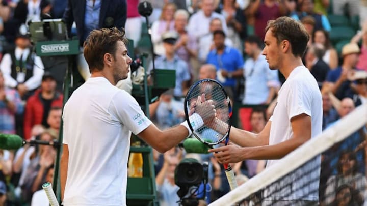 LONDON, ENGLAND - JULY 03: Stan Wawrinka of Suitzerland and Daniil Medvedev of Russia shake hands after their Gentlemen's Singles first round match on day one of the Wimbledon Lawn Tennis Championships at the All England Lawn Tennis and Croquet Club on July 3, 2017 in London, England. (Photo by David Ramos/Getty Images)