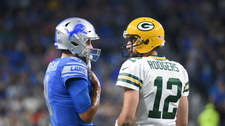 Oct 7, 2018; Detroit, MI, USA; Detroit Lions quarterback Matthew Stafford (9) and Green Bay Packers quarterback Aaron Rodgers (12) chat during the first quarter at Ford Field. Mandatory Credit: Tim Fuller-USA TODAY Sports