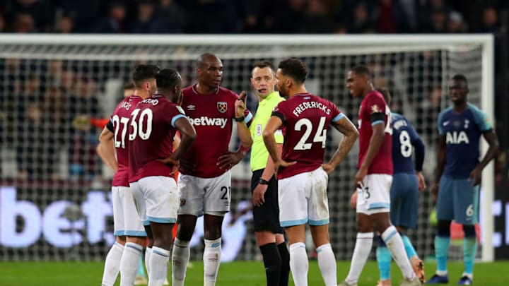 LONDON, ENGLAND - OCTOBER 31: Lucas Perez of West Ham United, Michail Antonio of West Ham United, Angelo Ogbonna of West Ham United and Ryan Fredericks of West Ham United argue with referee Stuart Attwell after the Carabao Cup Fourth Round match between West Ham United and Tottenham Hotspur at London Stadium on October 31, 2018 in London, England. (Photo by Catherine Ivill/Getty Images)