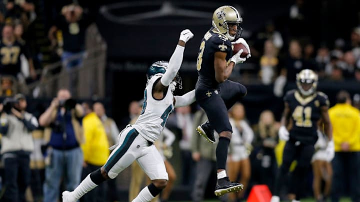 NEW ORLEANS, LOUISIANA - JANUARY 13: Michael Thomas #13 of the New Orleans Saints makes the catch under pressure from Josh Hawkins #48 of the Philadelphia Eagles during the fourth quarter in the NFC Divisional Playoff Game at Mercedes Benz Superdome on January 13, 2019 in New Orleans, Louisiana. (Photo by Jonathan Bachman/Getty Images)