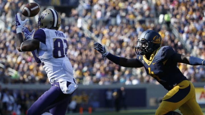 BERKELEY, CA - OCTOBER 11: Tightend Joshua Perkins #82 of the Washington Huskies catches a 25-yard touchdown pass as safety Avery Sebastian #4 of the California Golden Bears defends during the first quarter of their game on October 11, 2014 at California Memorial Stadium in Berkeley, California. (Photo by Stephen Lam/Getty Images)