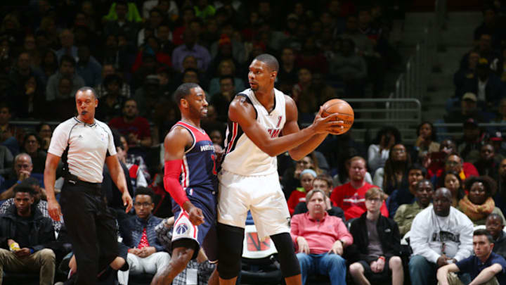 WASHINGTON, DC - JANUARY 3: Chris Bosh #1 of the Miami Heat defends the ball against John Wall #2 of the Washington Wizards during the game on January 3, 2016 at Verizon Center in Washington, District of Columbia. NOTE TO USER: User expressly acknowledges and agrees that, by downloading and or using this Photograph, user is consenting to the terms and conditions of the Getty Images License Agreement. Mandatory Copyright Notice: Copyright 2016 NBAE (Photo by Ned Dishman/NBAE via Getty Images)