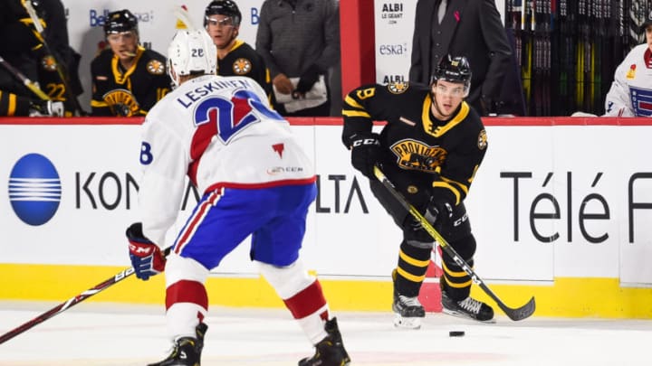 LAVAL, QC - OCTOBER 16: Providence Bruins left wing Ryan Fitzgerald (19) considers his options with the puck during the Providence Bruins versus the Laval Rocket game on October 16, 2019, at Place Bell in Laval, QC (Photo by David Kirouac/Icon Sportswire via Getty Images)