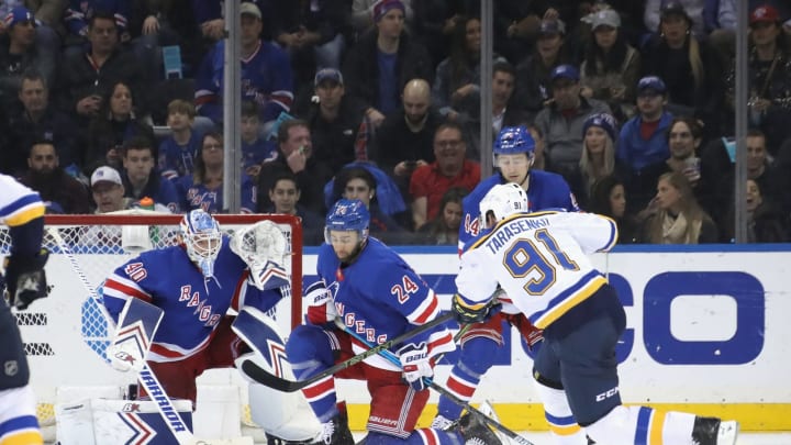 NEW YORK, NEW YORK – MARCH 29: Alexandar Georgiev #40 and Boo Nieves #24 of the New York Rangers defend against Vladimir Tarasenko #91 of the St. Louis Blues at Madison Square Garden on March 29, 2019 in New York City. The Rangers defeated the Blues 4-2. (Photo by Bruce Bennett/Getty Images)
