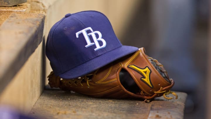 MINNEAPOLIS, MN - SEPTEMBER 13: A Tampa Bay Rays hat and glove on the steps of the dugout against the Minnesota Twins on September 13, 2013 at Target Field in Minneapolis, Minnesota. The Rays defeated the Twins 3-0. (Photo by Brace Hemmelgarn/Minnesota Twins/Getty Images)