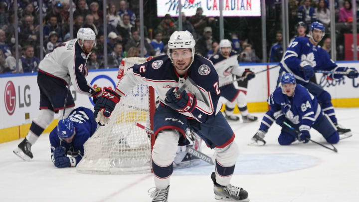 Feb 11, 2023; Toronto, Ontario, CAN; Columbus Blue Jackets defenseman Andrew Peeke (2) chases after a puck against the Toronto Maple Leafs during the third period at Scotiabank Arena. Mandatory Credit: John E. Sokolowski-USA TODAY Sports