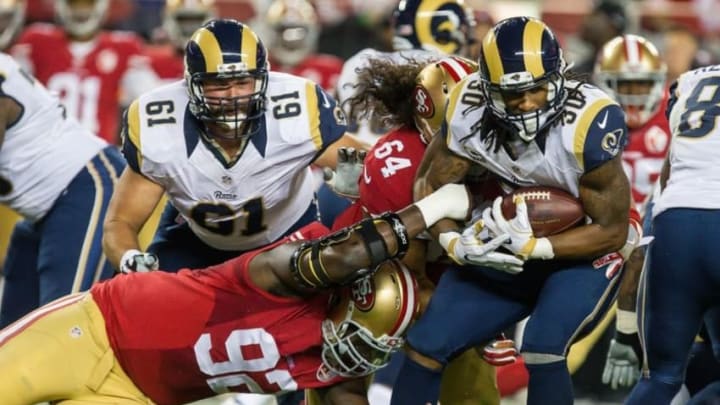Sep 12, 2016; Santa Clara, CA, USA; San Francisco 49ers defensive end Quinton Dial (92) and nose tackle Mike Purcell (64) combine against Los Angeles Rams running back Todd Gurley (30) during the first quarter at Lev'i's Stadium. Mandatory Credit: Kelley L Cox-USA TODAY Sports Sep 12, 2016; Santa Clara, CA, USA; San Francisco 49ers defensive end Quinton Dial (92) and nose tackle Mike Purcell (64) combine against Los Angeles Rams running back Todd Gurley (30) during the first quarter at Lev'i's Stadium. Mandatory Credit: Kelley L Cox-USA TODAY Sports