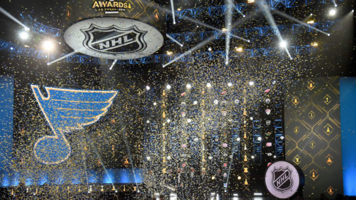 LAS VEGAS, NEVADA - JUNE 19: (L-R) Executive Vice President, Chief Financial & Administrative Officer Phil Siddle, goaltender Jordan Binnington, head coach Craig Berube, center Ryan O'Reilly, general manager Doug Armstrong and Chairman and Governor Tom Stillman of the St. Louis Blues display the Stanley Cup onstage during the 2019 NHL Awards at the Mandalay Bay Events Center on June 19, 2019 in Las Vegas, Nevada. (Photo by Ethan Miller/Getty Images)