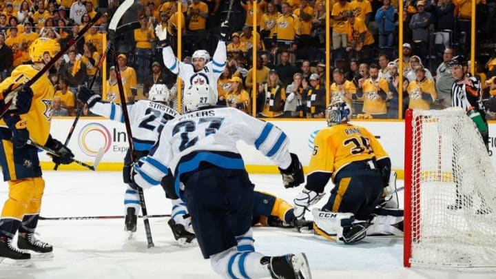 NASHVILLE, TN - APRIL 29: Mark Scheifele #55 of the Winnipeg Jets celebrates his game tying goal against the Pekka Rinne #35 of the Nashville Predators in Game Two of the Western Conference Second Round during the 2018 NHL Stanley Cup Playoffs at Bridgestone Arena on April 29, 2018 in Nashville, Tennessee. (Photo by John Russell/NHLI via Getty Images)