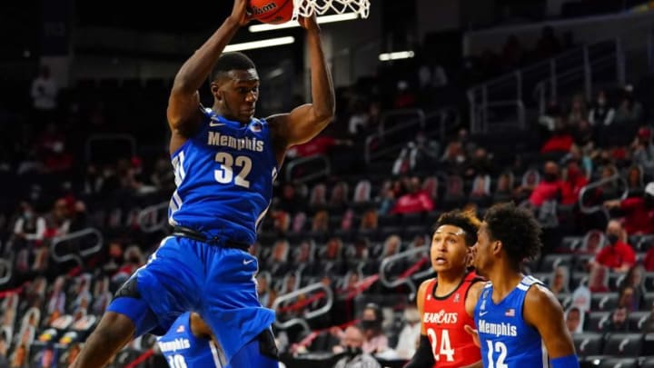 Memphis Tigers center Moussa Cisse (32) rebound the ball in the first half of a men's NCAA basketball game against the Cincinnati Bearcats, Sunday, Feb. 28, 2021, at Fifth Third Arena in Cincinnati.Memphis Tigers At Cincinnati Bearcats Feb 28