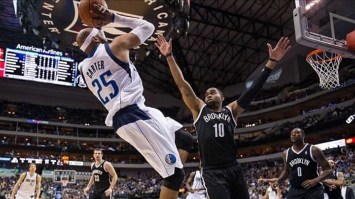 Mar 23, 2014; Dallas, TX, USA; Dallas Mavericks guard Vince Carter (25) shoots over Brooklyn Nets guard Marcus Thornton (10) during the second half at the American Airlines Center. The Nets defeated the Mavericks 107-104 in overtime. Mandatory Credit: Jerome Miron-USA TODAY Sports