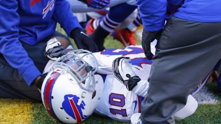 Nov 3, 2013; Orchard Park, NY, USA; Trainers attend to Buffalo Bills wide receiver Robert Woods (10) after getting hurt on a play during the second half against the Kansas City Chiefs at Ralph Wilson Stadium. Chiefs beat the Bills 23 to 13. Mandatory Credit: Timothy T. Ludwig-USA TODAY Sports