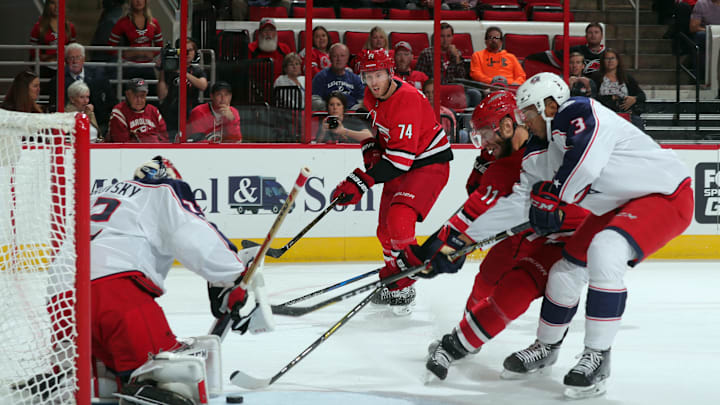 RALEIGH, NC – OCTOBER 10: Seth Jones #3 of the Columbus Blue Jackets ties up the stick of Jordan Staal #11 of the Carolina Hurricanes as Sergei Bobrovsky #72 defends the goal during an NHL game on October 10, 2017 at PNC Arena in Raleigh, North Carolina. (Photo by Gregg Forwerck/NHLI via Getty Images)