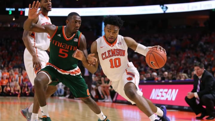 Jan 16, 2016; Greenville, SC, USA; Clemson Tigers guard Gabe DeVoe (10) drives to the basket as Miami Hurricanes guard Davon Reed (5) defends in the second half at Bon Secours Wellness Arena. The Tigers won 76-65. Mandatory Credit: Dawson Powers-USA TODAY Sports