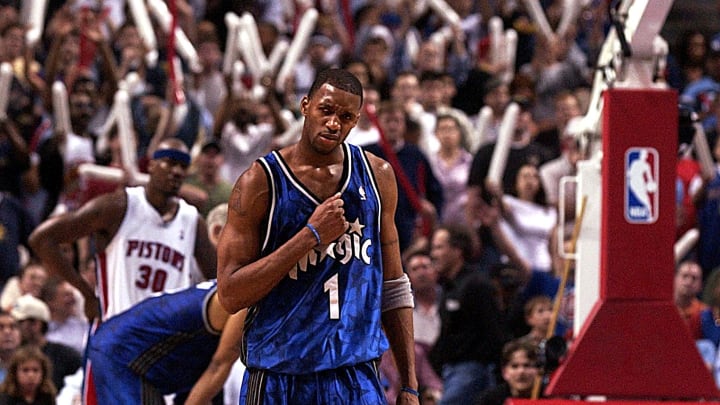 Orlando Magic Tracy McGrady gestures on the way down court during their game against the Detroit Pistons in game one of the Eastern Conference quarter-finals at the Palace of Auburn Hills, Michigan on 20 April 2003. The Magic beat the Pistons 99-94. McGrady was the high scorer in the game with 43 points. AFP Photo/Jeff KOWALSKY (Photo by JEFF KOWALSKY / AFP) (Photo credit should read JEFF KOWALSKY/AFP via Getty Images)