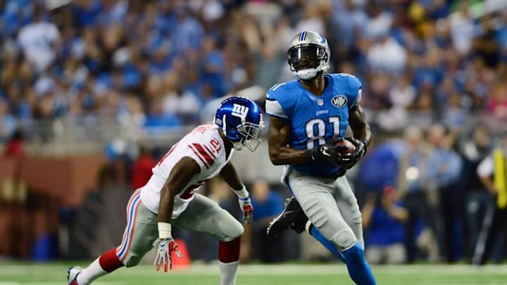 Sep 8, 2014; Detroit, MI, USA; Detroit Lions wide receiver Calvin Johnson (81) makes a catch and runs from New York Giants cornerback Dominique Rodgers-Cromartie (21) during the second quarter at Ford Field. Mandatory Credit: Andrew Weber-USA TODAY Sports