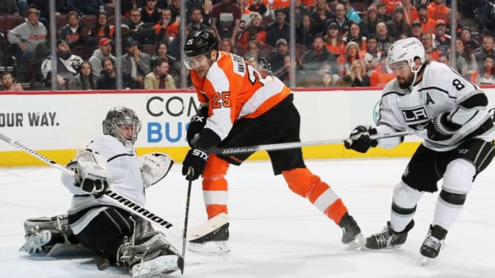 PHILADELPHIA, PA - FEBRUARY 07: Jonathan Quick #32 of the Los Angeles Kings makes a pad save as Drew Doughty #8 defends against James van Riemsdyk #25 of the Philadelphia Flyers on February 7, 2019 at the Wells Fargo Center in Philadelphia, Pennsylvania. (Photo by Len Redkoles/NHLI via Getty Images)