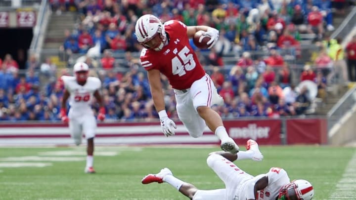 MADISON, WI - SEPTEMBER 08: Alec Ingold #45 of the Wisconsin Badgers jumps over Jalin Burrell #13 of the New Mexico Lobos during the first half at Camp Randall Stadium on September 8, 2018 in Madison, Wisconsin. (Photo by Stacy Revere/Getty Images)