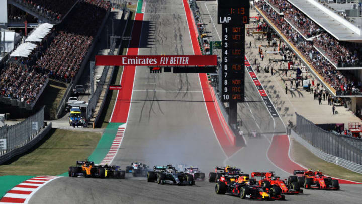 AUSTIN, TEXAS - NOVEMBER 03: Max Verstappen of the Netherlands driving the (33) Aston Martin Red Bull Racing RB15 leads Sebastian Vettel of Germany driving the (5) Scuderia Ferrari SF90 and Charles Leclerc of Monaco driving the (16) Scuderia Ferrari SF90 into turn one during the F1 Grand Prix of USA at Circuit of The Americas on November 03, 2019 in Austin, Texas. (Photo by Mark Thompson/Getty Images)