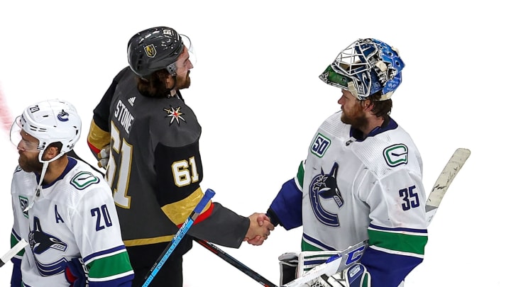 Mark Stone shakes hands with Thatcher Demko after a very hard-fought series (Photo by Bruce Bennett/Getty Images)