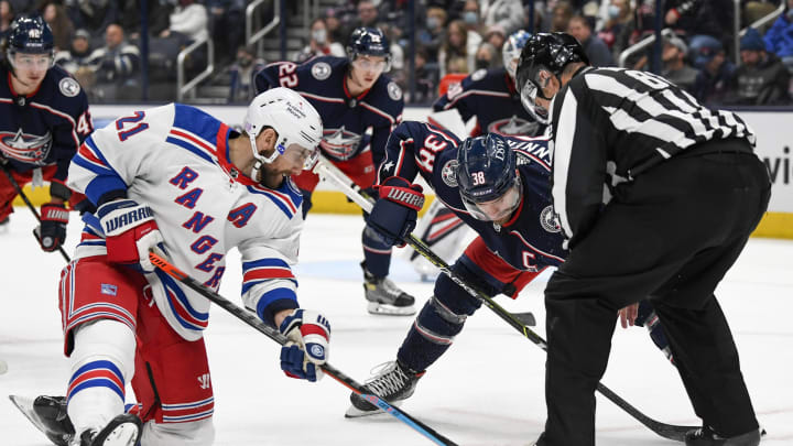 Nov 13, 2021; Columbus, Ohio, USA; New York Rangers center Barclay Goodrow (21) wins a face-off against Columbus Blue Jackets center Boone Jenner (38) in the second period at Nationwide Arena. Mandatory Credit: Gaelen Morse-USA TODAY Sports