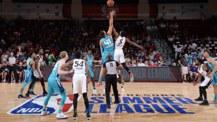 LAS VEGAS, NV - JULY 8: Willy Hernangomez (41) of the Charlotte Hornets and Derrick Jones Jr. (5) of the Miami Heat reach for the tip-off during the game on July 8, 2018 at the Cox Pavilion in Las Vegas, Nevada. NOTE TO USER: User expressly acknowledges and agrees that, by downloading and or using this Photograph, user is consenting to the terms and conditions of the Getty Images License Agreement. Mandatory Copyright Notice: Copyright 2018 NBAE (Photo by Bart Young/NBAE via Getty Images)