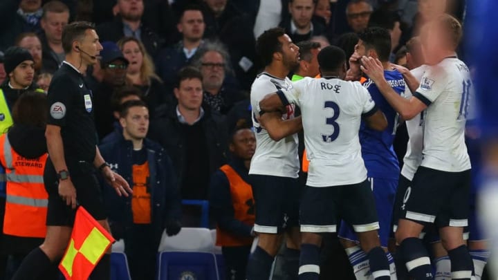 LONDON, ENGLAND - MAY 02 : The assistant referee watches as Diego Costa of Chelsea holds his face after he clashes with Mousa Dembele of Tottenham Hotspur during the Barclays Premier League match between Chelsea and Tottenham Hotspur at Stamford Bridge on May 2, 2016 in London, England. (Photo by Catherine Ivill - AMA/Getty Images)