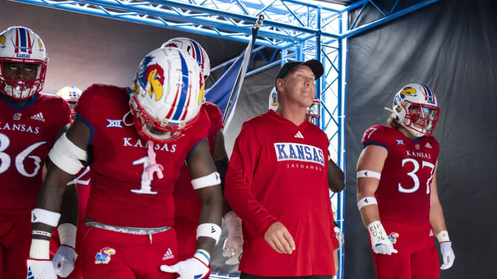 Sep 23, 2023; Lawrence, Kansas, USA; Kansas Jayhawks head coach Lance Leipold leads his team onto the field prior to a game against the Brigham Young Cougars at David Booth Kansas Memorial Stadium. Mandatory Credit: Jay Biggerstaff-USA TODAY Sports