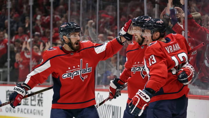WASHINGTON, DC – NOVEMBER 03: Jakub Vrana #13 of the Washington Capitals celebrates with Evgeny Kuznetsov #92 and Michal Kempny #6 after scoring his first goal of the game in the first period against the Calgary Flames at Capital One Arena on November 3, 2019 in Washington, DC. (Photo by Patrick McDermott/NHLI via Getty Images)