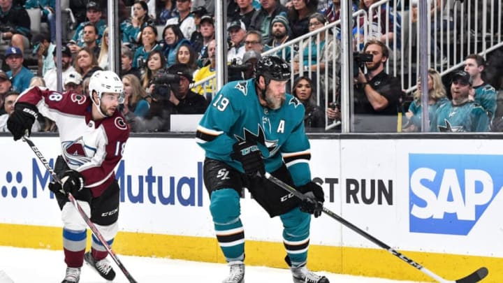 SAN JOSE, CA - APRIL 28: Joe Thornton #19 of the San Jose Sharks skates with the puck against Derick Brassard #18 of the Colorado Avalanche in Game Two of the Western Conference Second Round during the 2019 NHL Stanley Cup Playoffs at SAP Center on April 28, 2019 in San Jose, California (Photo by Brandon Magnus/NHLI via Getty Images)