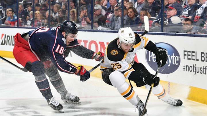 COLUMBUS, OH - MAY 2: Pierre-Luc Dubois #18 of the Columbus Blue Jackets attempts to knock Brandon Carlo #25 of the Boston Bruins off the puck during the third period in Game Four of the Eastern Conference Second Round during the 2019 NHL Stanley Cup Playoffs on May 2, 2019 at Nationwide Arena in Columbus, Ohio. (Photo by Jamie Sabau/NHLI via Getty Images)